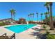 Community pool with lounge chairs and palm trees, perfect for relaxation at 5952 Long Bay St, Las Vegas, NV 89148