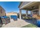 A covered patio with comfortable seating offers an inviting outdoor space for relaxation at 6033 Bugsy St, North Las Vegas, NV 89081