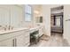 Stylish bathroom with dual sinks, a vanity, and contemporary finishes at 6033 Bugsy St, North Las Vegas, NV 89081