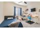 Bedroom featuring a TV, shelves, and a double bed at 6033 Bugsy St, North Las Vegas, NV 89081