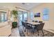 Dining area with marble table and stylish chairs adjacent to the living area at 6033 Bugsy St, North Las Vegas, NV 89081