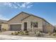 Charming single-story home featuring desert landscaping and a two-car garage at 6033 Bugsy St, North Las Vegas, NV 89081