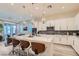 Bright kitchen with island, modern pendant lights, and stainless steel appliances at 6033 Bugsy St, North Las Vegas, NV 89081