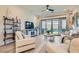 Bright living area with sleek furnishings and natural light from sliding glass doors at 6033 Bugsy St, North Las Vegas, NV 89081