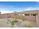 The property includes a backyard with a rock garden and exterior brick walls at 6144 Corbin Ave, Las Vegas, NV 89122