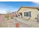 Spacious backyard featuring a rock garden, hammock and covered patio at 6144 Corbin Ave, Las Vegas, NV 89122