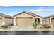 Single-story home featuring a two-car garage and desert landscaping at 6144 Corbin Ave, Las Vegas, NV 89122