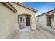 View of the front porch with a seating area, decorative rock landscaping, and a covered entryway at 6144 Corbin Ave, Las Vegas, NV 89122