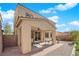 Covered patio features an outdoor dining area and BBQ with low maintenance backyard at 6733 Fast Brook Ct, North Las Vegas, NV 89084