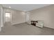 Neutral bedroom with seating area, carpeted floors, and a window with blinds at 6733 Fast Brook Ct, North Las Vegas, NV 89084