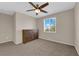 Bedroom featuring carpet, ceiling fan and natural light from the window at 6733 Fast Brook Ct, North Las Vegas, NV 89084