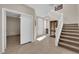 Welcoming entryway featuring tile flooring, staircase, and convenient access to other rooms of the home at 6733 Fast Brook Ct, North Las Vegas, NV 89084