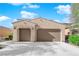 Inviting single story home with a two-car garage and a well maintained desert landscape at 6733 Fast Brook Ct, North Las Vegas, NV 89084