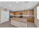 Modern kitchen with a large center island, stainless steel appliances, and abundant cabinet space at 6733 Fast Brook Ct, North Las Vegas, NV 89084