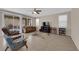 Inviting living room with sliding door, tile floors, large windows, and comfortable seating at 6733 Fast Brook Ct, North Las Vegas, NV 89084