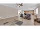 Open-concept living room featuring tile floors, ample natural light, and a seamless transition to the kitchen at 6733 Fast Brook Ct, North Las Vegas, NV 89084