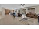 Spacious living area featuring tile floors, bright windows, and an open layout flowing into the kitchen at 6733 Fast Brook Ct, North Las Vegas, NV 89084