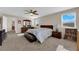 Main bedroom featuring a ceiling fan, carpet, and two windows at 6733 Fast Brook Ct, North Las Vegas, NV 89084