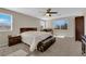 Main bedroom featuring a ceiling fan, carpet, and two windows at 6733 Fast Brook Ct, North Las Vegas, NV 89084