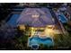 Aerial view showcasing a pool, spa, lounge chairs, and spacious patio with an outdoor kitchen at 68 Isleworth Dr, Henderson, NV 89052