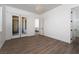 Bedroom with wood flooring and slider door offering a blend of style and functionality at 68 Isleworth Dr, Henderson, NV 89052