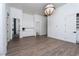 A bright bedroom featuring wood flooring and built-in cabinetry for ample storage at 68 Isleworth Dr, Henderson, NV 89052