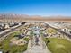 Aerial perspective of community amenities including a pool, playground, and walking paths at 6855 Evening Orchid St, North Las Vegas, NV 89086