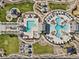 Overhead shot of a community with multiple pools, playgrounds, and lounging areas for residents at 6855 Evening Orchid St, North Las Vegas, NV 89086