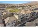 Neighborhood featuring multiple modern homes with solar panels, showcasing community living at 6855 Evening Orchid St, North Las Vegas, NV 89086