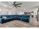 Spacious living area boasting an open floor plan with a modern ceiling fan at 6855 Evening Orchid St, North Las Vegas, NV 89086