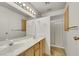 Neutral bathroom with double sinks, granite countertop, and white cabinets at 700 Northstar St, Las Vegas, NV 89107