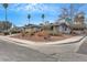 Corner lot home with mature trees, a yard, and a low-maintenance desert landscape at 700 Northstar St, Las Vegas, NV 89107