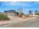 Single-story home with attached garage, mature trees, and desert-style landscaping at 700 Northstar St, Las Vegas, NV 89107