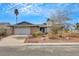 Charming single-story home featuring an attached two-car garage and mature landscaping at 700 Northstar St, Las Vegas, NV 89107