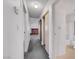 Hallway featuring access to the bathroom, fireplace, and sliding door closet at 700 Northstar St, Las Vegas, NV 89107