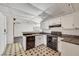 Traditional style kitchen featuring black appliances, white cabinets, and tile floors at 700 Northstar St, Las Vegas, NV 89107