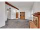 Cozy living room with brick fireplace, wooden beam, and cabinet perfect for gatherings at 700 Northstar St, Las Vegas, NV 89107