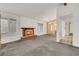 Bright living room with brick fireplace, lots of natural light, and neutral carpet and paint at 700 Northstar St, Las Vegas, NV 89107