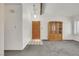 View of entry to living room featuring neutral paint and carpet at 700 Northstar St, Las Vegas, NV 89107