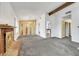 Spacious living room featuring a brick fireplace and large windows at 700 Northstar St, Las Vegas, NV 89107