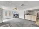 Open living space connects to the kitchen, featuring bright light and a ceiling fan at 700 Northstar St, Las Vegas, NV 89107