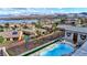 Aerial view of the pool and the views of the lake and mountains beyond at 8 Reverie Heights Ave, Henderson, NV 89011