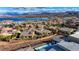 Stunning aerial view of the community with lake and mountain views in the background at 8 Reverie Heights Ave, Henderson, NV 89011