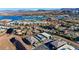 This aerial view showcases the stunning community with its lake, mountains, and luxury homes at 8 Reverie Heights Ave, Henderson, NV 89011