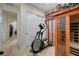 Exercise room featuring an elliptical machine, sauna, and sliding closet doors at 8 Reverie Heights Ave, Henderson, NV 89011