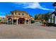 Inviting corner commercial building featuring a terracotta roof, and glass encased patio with brick paver exterior at 8 Reverie Heights Ave, Henderson, NV 89011