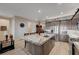 Spacious kitchen island featuring granite countertops, stainless steel sink, and seating at 8 Reverie Heights Ave, Henderson, NV 89011