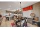 A spacious kitchen featuring stainless steel appliances, granite countertops, and a cozy dining area at 8 Reverie Heights Ave, Henderson, NV 89011