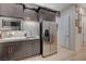 Kitchenette with stainless steel appliances, granite counters, and modern backsplash at 8 Reverie Heights Ave, Henderson, NV 89011