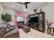 Cozy living room featuring a dark cabinet and a comfortable recliner set at 8 Reverie Heights Ave, Henderson, NV 89011